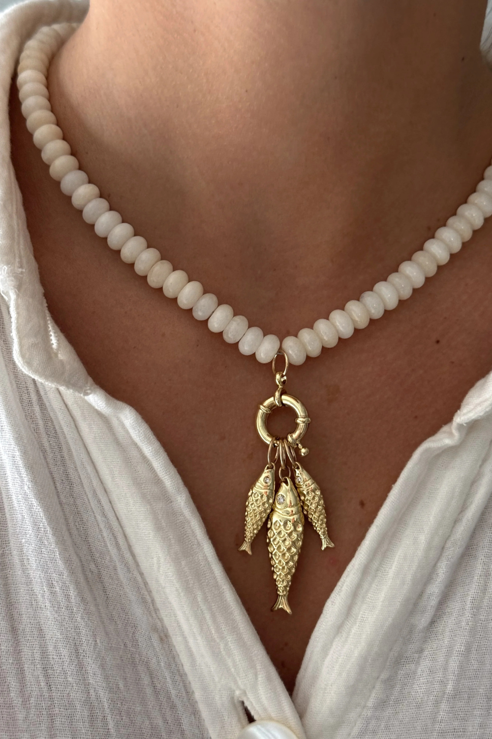CREAM FISH ON NECKLACE